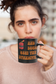 Girl holding black coffee mug